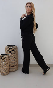 Female model wearing Bonnie Knitted Lounge Suit - Black- showcasing the latest ladies fashion with free delivery 