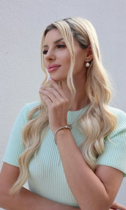 Female model wearing Twins at Heart Bracelet- showcasing the latest ladies fashion with free delivery 