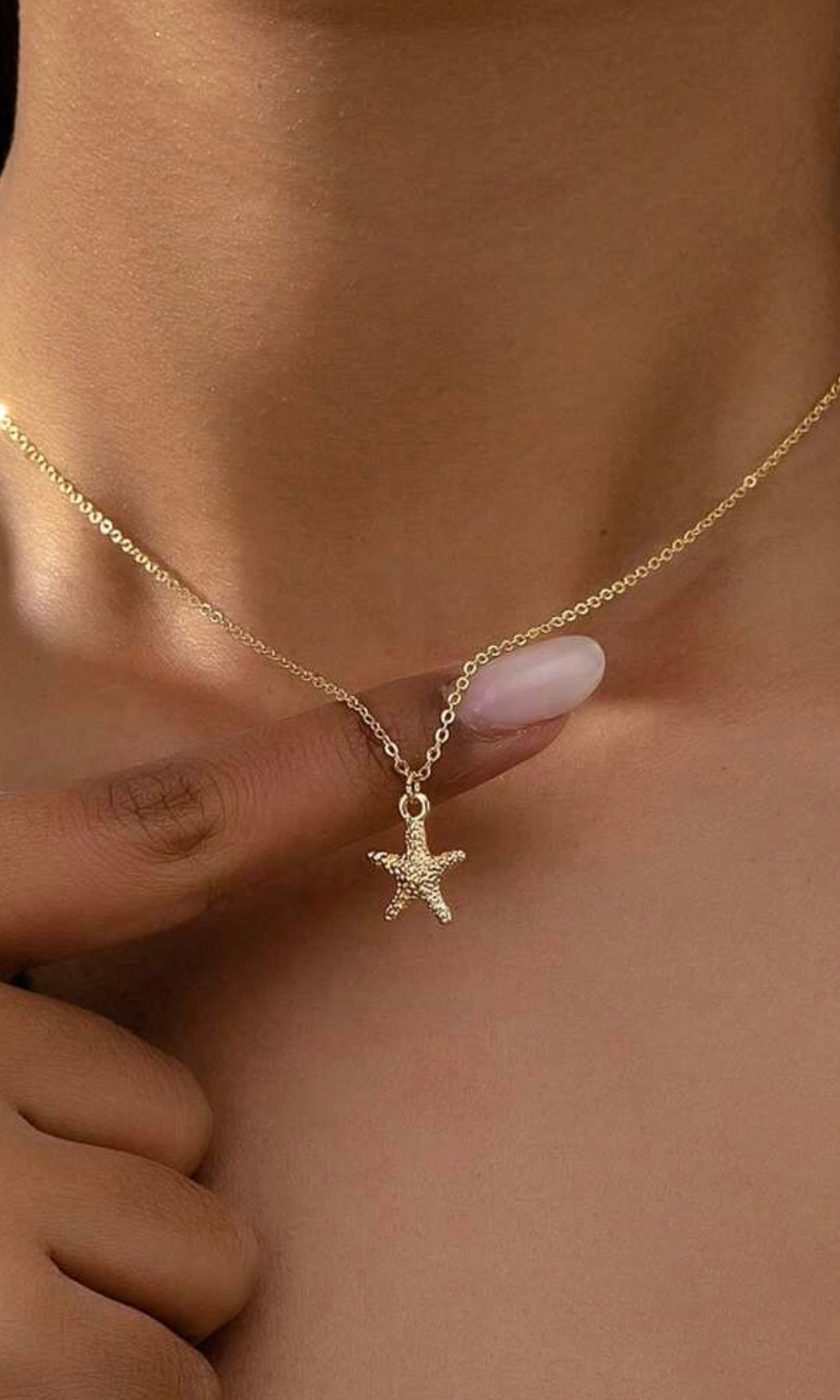 Female model wearing Joanna Starfish Gold Necklace- showcasing the latest ladies fashion with free delivery 