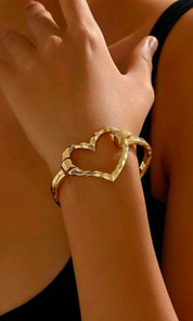 Female model wearing Ruth Heart Outlined Bold Bracelet- showcasing the latest ladies fashion with free delivery 