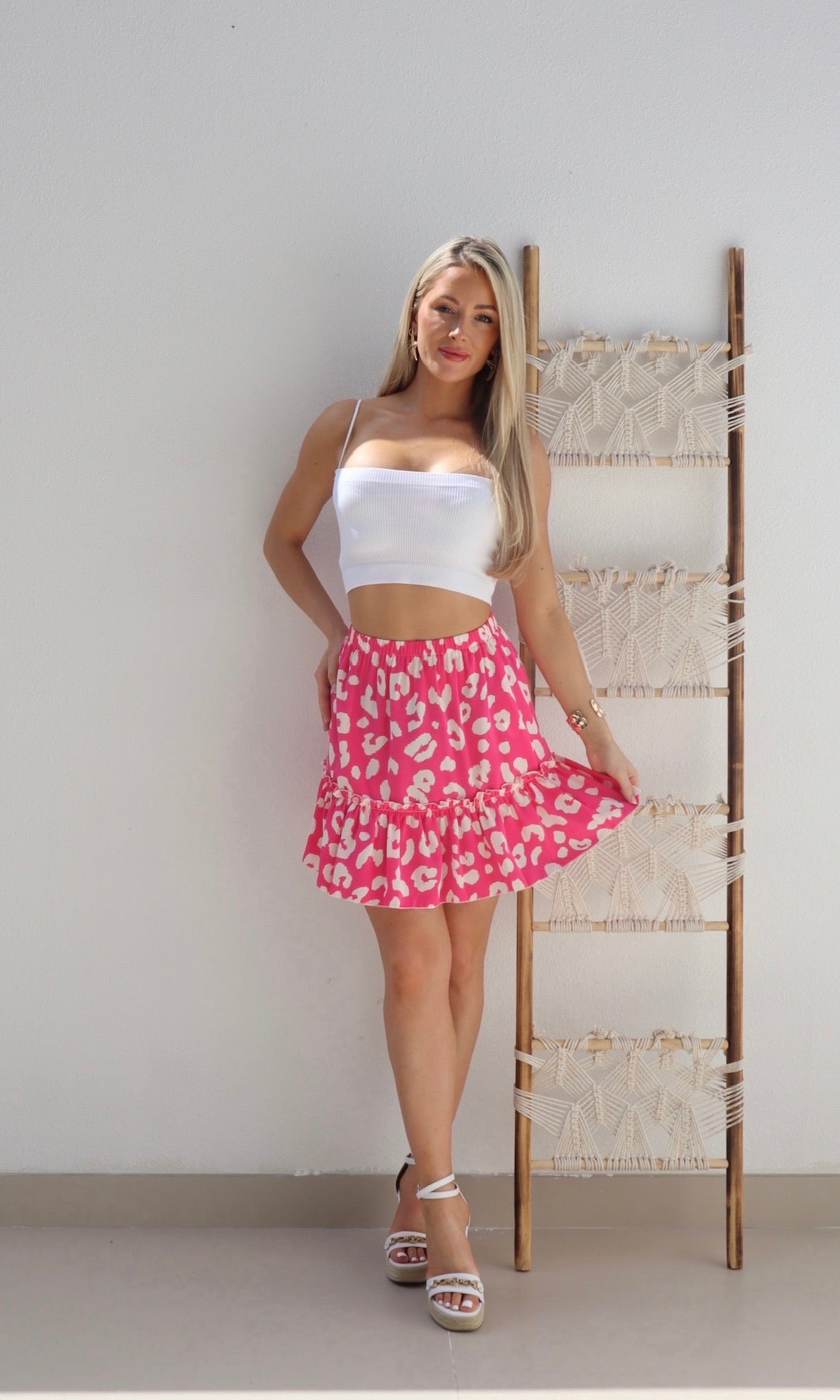 Female model wearing Aria Bold Leopard Print Mini Skirt - Hot Pink- showcasing the latest ladies fashion with free delivery 