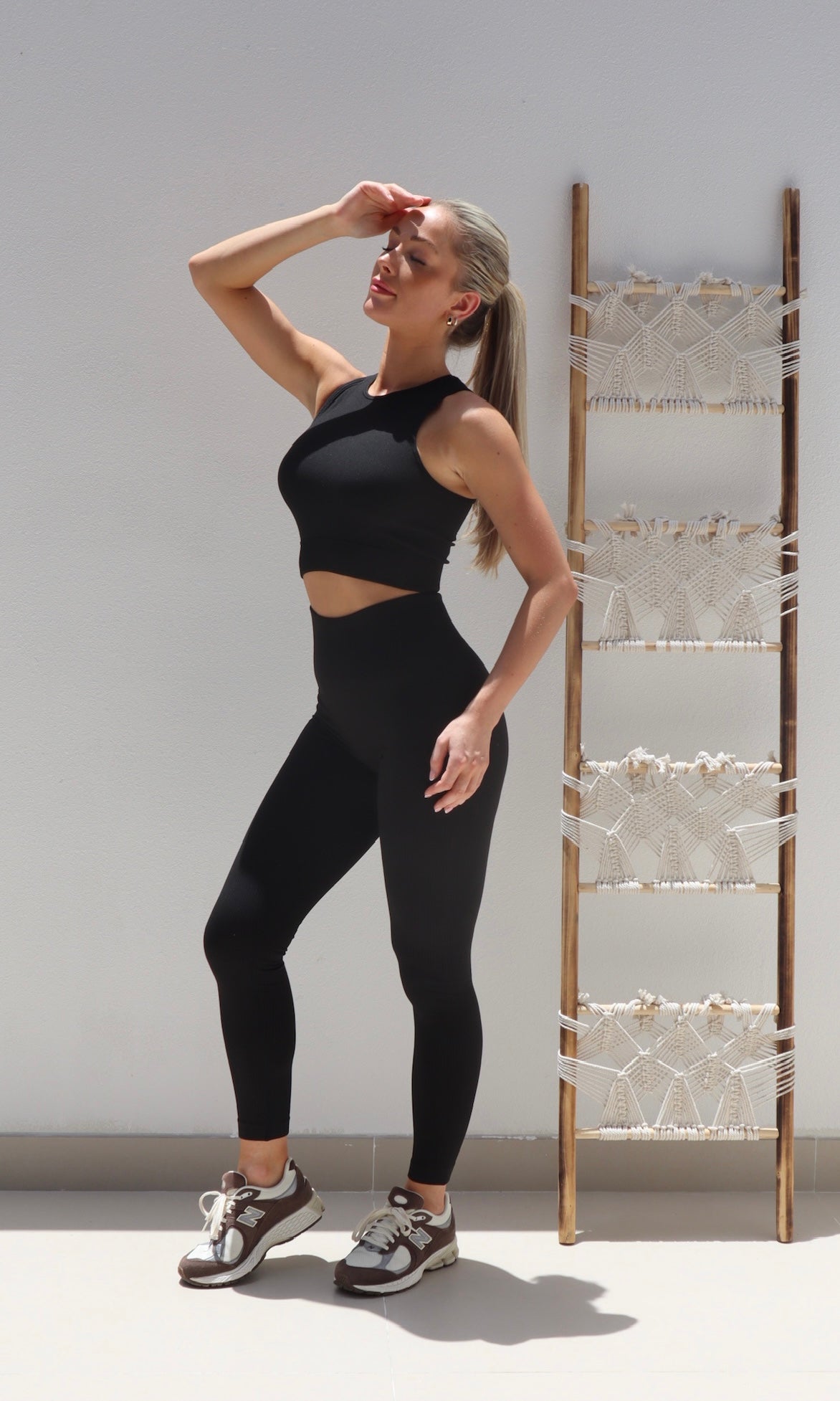 Female model wearing Beve Leggings and Sport Bra Set - Black- showcasing the latest ladies fashion with free delivery 