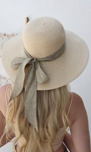 Female model wearing Angelica Straw Hat - Cream- showcasing the latest ladies fashion with free delivery 