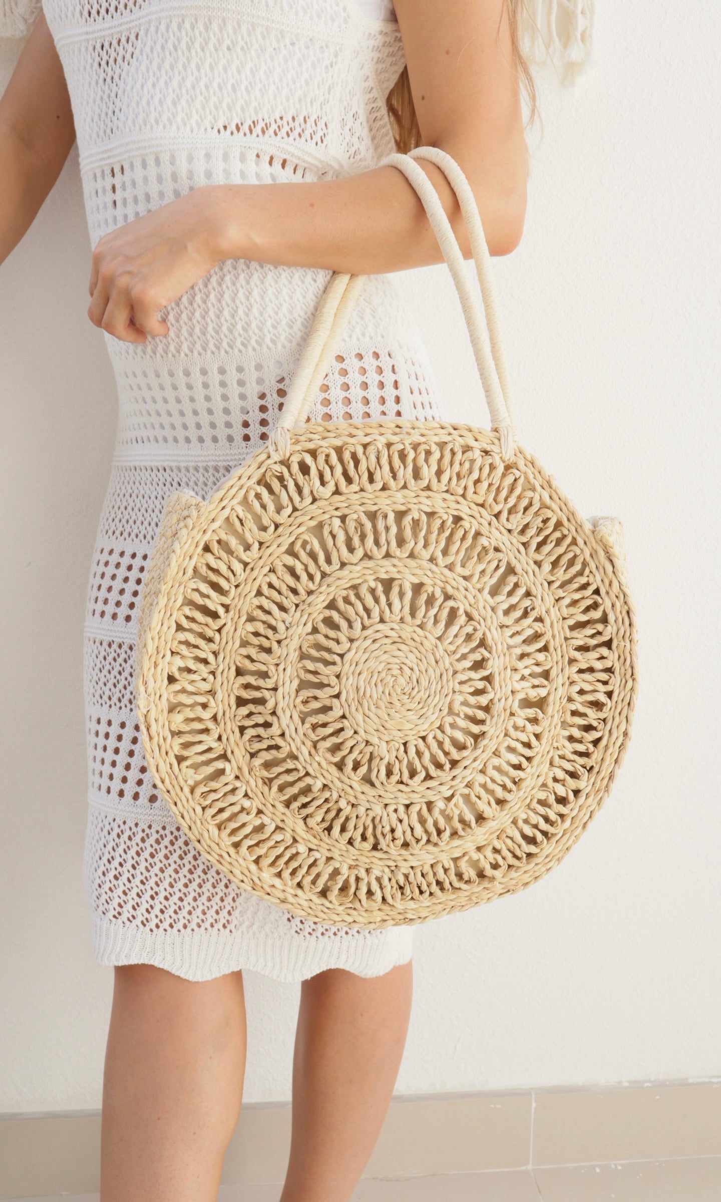 Female model wearing Rosie Circular Straw Bag - Natural- showcasing the latest ladies fashion with free delivery 