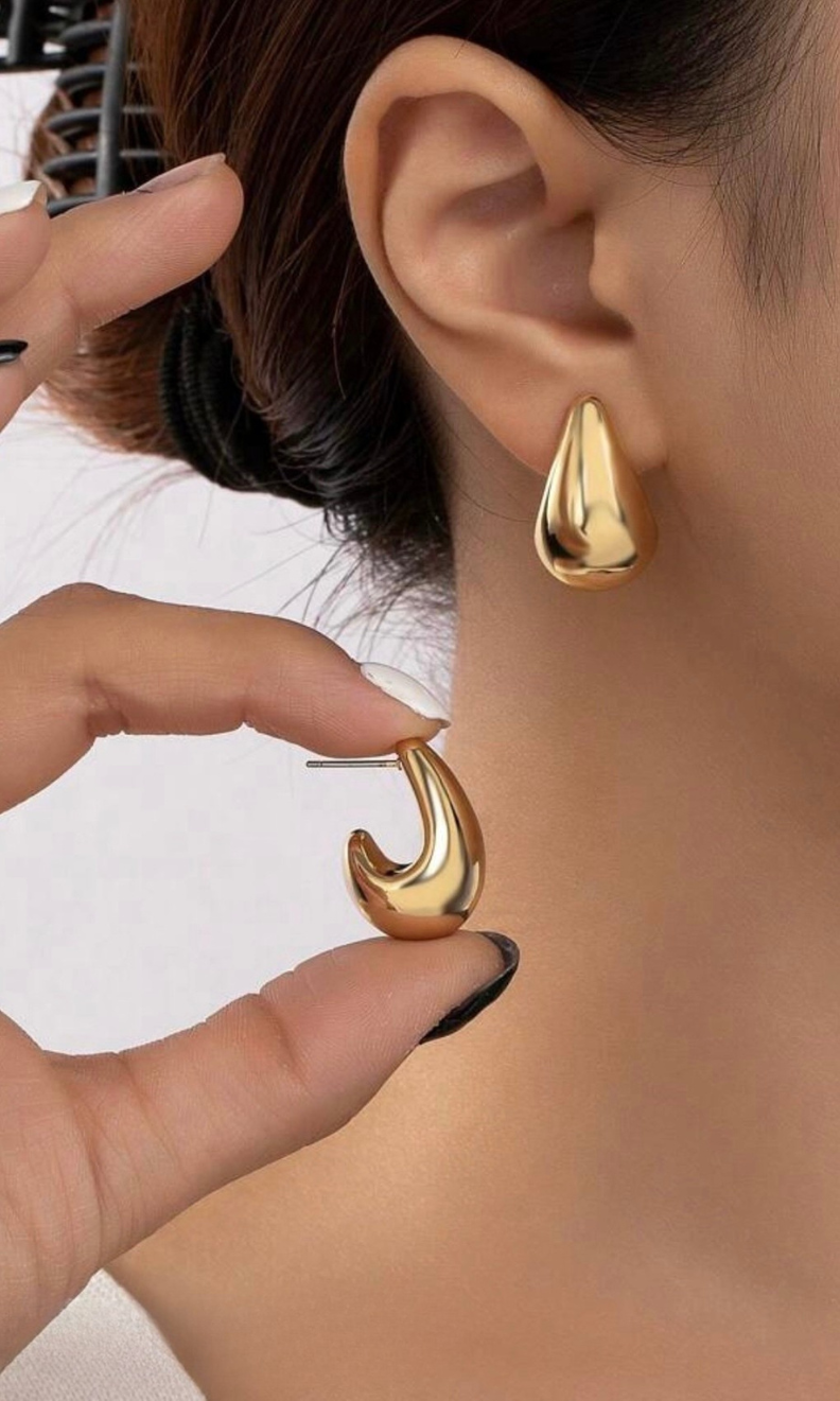 Female model wearing Marcie Solid Gold Earring- showcasing the latest ladies fashion with free delivery 